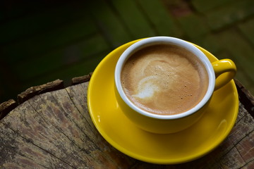 Cup of hot coffee on the wooden floor in the morning