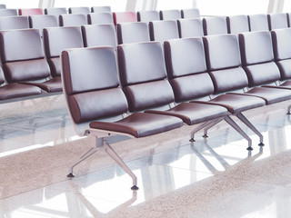 Empty chairs at the airport terminal.