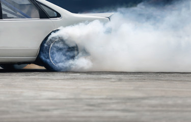 Race drift car burning tires on speed track © toa555
