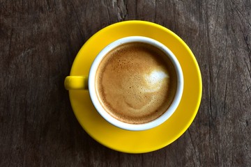 Cup of hot coffee on the wooden floor in the morning