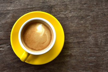 Cup of hot coffee on the wooden floor in the morning