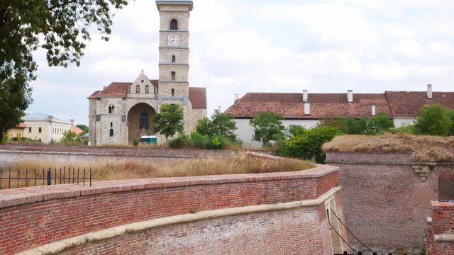 Tilt up shot of the ramparts and roman catholic archdiocese of the fortified old town of Alba Iulia, Romania