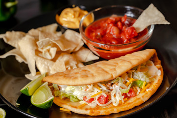 Close up Homemade Baja beef Tacos salad with tomato Salsa and Chips - mexican food