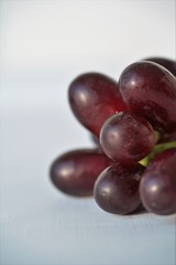 fresh red grapes on white background