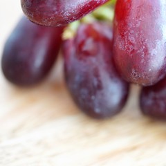 macro view on bright fresh grapes on wooden background