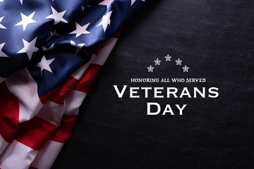 Happy Veterans Day. American flags with the text thank you veterans against a blackboard background. November 11. - obrazy, fototapety, plakaty