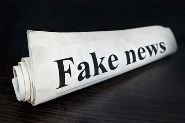 Daily news newspaper headline reading fake news concept for false event news headline. Fake News...