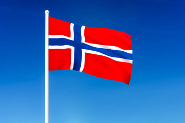 Waving flag of Norway on the blue sky background