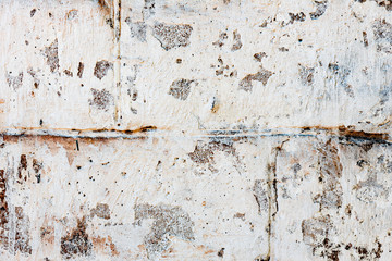 Texture of a concrete wall with cracks and scratches which can be used as a background