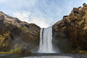 Waterfall Skogafoss (part of Skoga river taking its origin in the Highlands of Iceland) on the south coast of Iceland