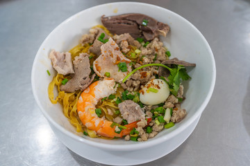Fototapeta na wymiar Bowl of delicious shrimp and pork noodle- Vietnamese cuisine