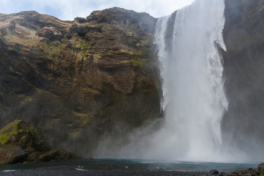 Waterfall Skogafoss (part of Skoga river taking its origin in the Highlands of Iceland) on the south coast of Iceland