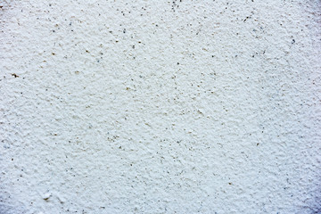 Texture of a concrete wall with cracks and scratches which can be used as a background