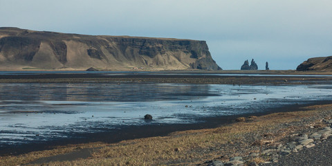 An outwash plain Mýrdalssandur in Iceland built by jokulhaups of the Mýrdalsjökull glacier which jokulhaups were caused by volcanic activity and eruptions of Katla that sits underneath its ice sheet