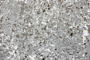 Texture of a concrete wall with cracks and scratches which can be used as a background