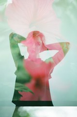 portrait of woman double exposed with flowers