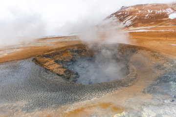 Panorama of geothermal area Hverar&ouml;nd (Hverir), situated by the orange-red clay coloured tuff mountain Namafjall south of N&aacute;maskar&eth; in Iceland, with details and patterns