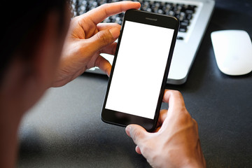 Cropped shot view of man hands holding smart phone with blank copy space screen for your text message or information content, female reading text message on cell telephone during in urban setting. 