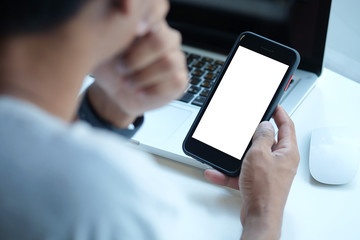 Cropped shot view of man hands holding smart phone with blank copy space screen for your text message or information content, female reading text message on cell telephone during in urban setting. 