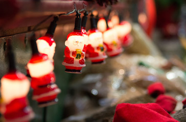 Obraz na płótnie Canvas Lights in the form of Santa Claus for Christmas decoration. Christmas market Christmas concept.