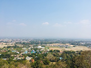 Landscape view point of low mountain, see small house village and blue sky
