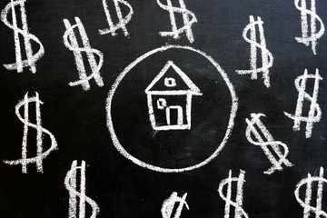 Loan and property investment. Chalk drawn house and dollar signs.