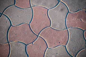 Texture of paving slabs overgrown with grass. Background image of a stratum stone