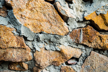 The texture of the old masonry. Background image of a stone-lined wall