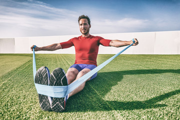 Resistance bands man training arms and shoulders workout