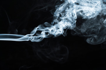 Photo of a wisp of smoke on a dark background