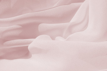 Light draped chiffon fabric in pink for festive backgrounds