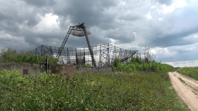 Kharkov, Ukraine - 12th of August 2019: 4K Secret object behind wall lost in the countryside, "guarded object" written in Ukrainian