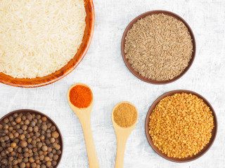 Spices set and rice on white concrete background. Modern apothecary, naturopathy and ayurveda concept.