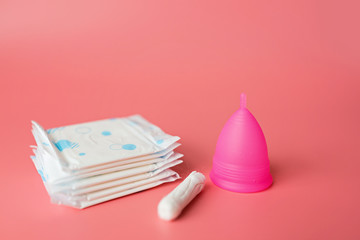 Menstrual cup, sanitary pad, tampon. Alternative feminine hygiene product during the period. Women health concept. Copy space. Eco friendly concept, zero waste product. Flat lay, mockup, template