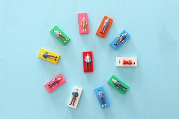 business concept image of people figures over wooden table, human resources and management concept