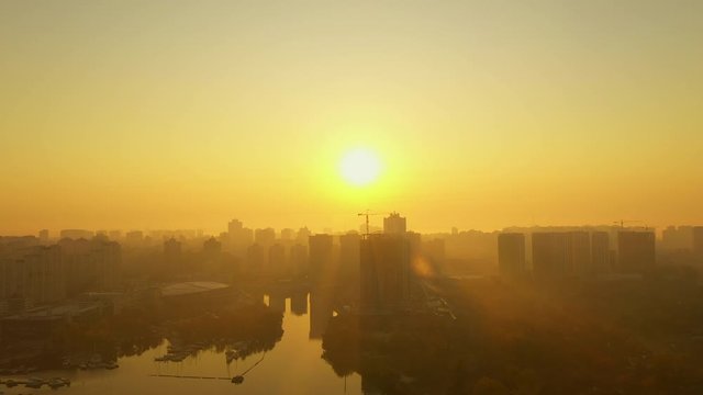 4k Sunrise over the metropolis Beautiful cityscape early in the morning. Aerial drone shot