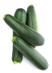 Fresh ripe green zucchinis on white background, top view