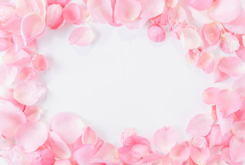 Fototapeta premium Top view of pink rose petals on white background.Valentine's day concept.