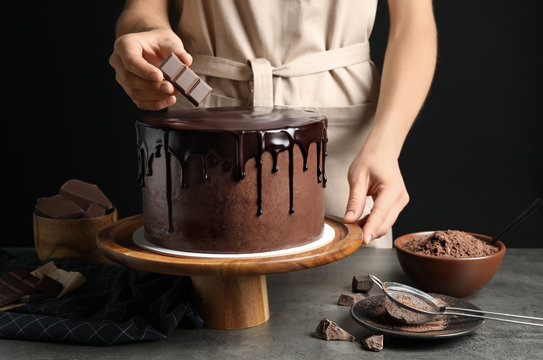 Chef Making Fresh Delicious Chocolate Cake At Grey Table, Closeup