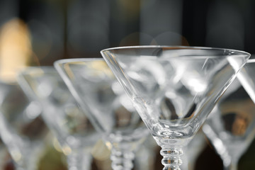 Empty martini glasses on blurred background, closeup