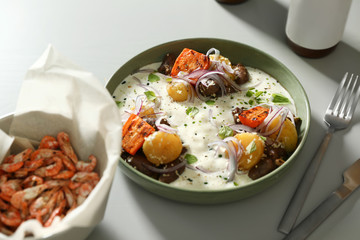 Tasty dish served on light table, closeup