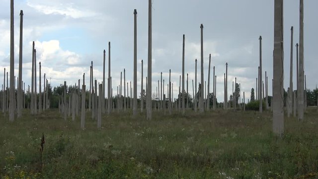Kharkov, Ukraine - 12th of August 2019: 4K Zoom out concrete posts in the deserted ionospheric observatory