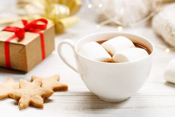 Obraz na płótnie Canvas Hot chocolate with marshmallow on Christmas table background.