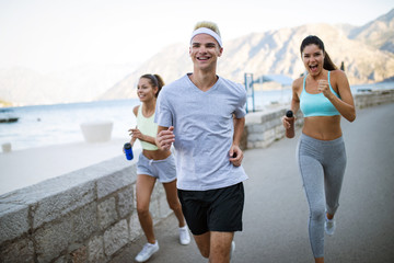 Fototapeta premium Friends fitness training together outdoors living active healthy