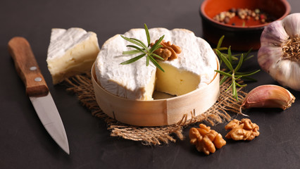 Obraz na płótnie Canvas camembert, cheese with walnut and rosemary
