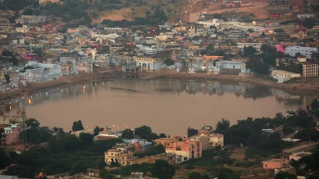 Unidentified Indian people at ritual washing in the sacred Sarovar lake. Pushkar - famous worship place in India