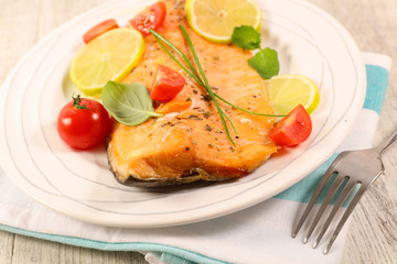 salmon fillet with tomato, basil and lemon