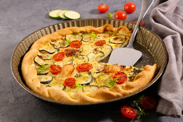 vegetable quiche with zucchini and tomato