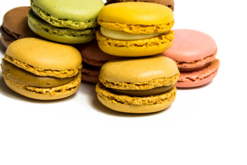 Colored macarons isolated on white background, typical French dish