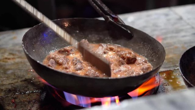 Traditional Indian, Pakistani mutton karahi being prepared - 4K